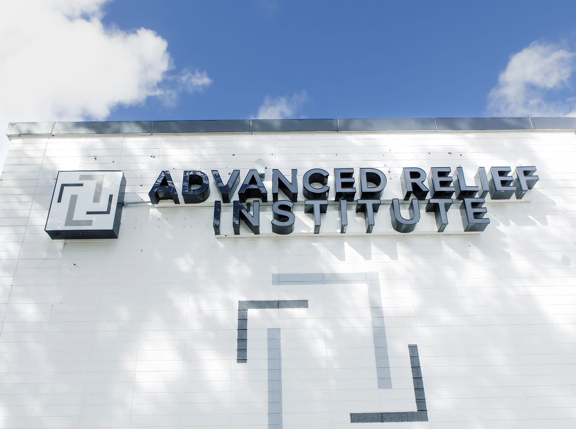 Advanced Relief Institute logo on a door
